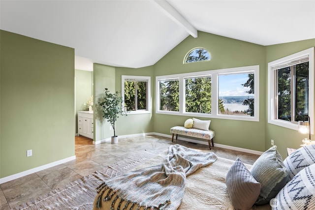 living area featuring lofted ceiling with beams and baseboards