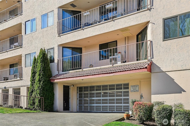 view of building exterior with an attached garage