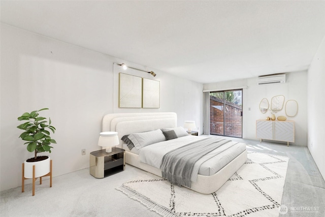 carpeted bedroom with a wall unit AC