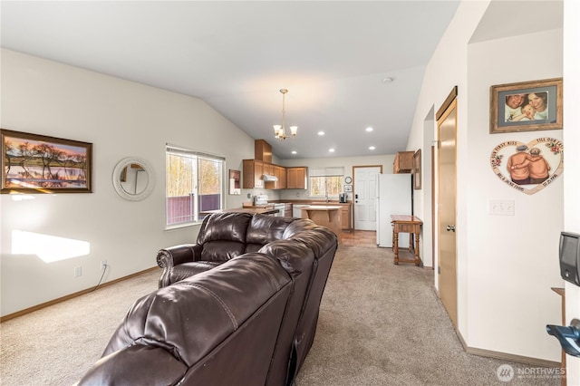 living area with light carpet, a notable chandelier, lofted ceiling, recessed lighting, and baseboards