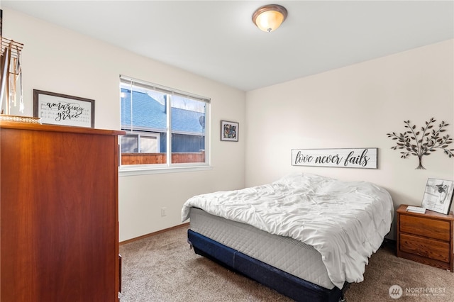 carpeted bedroom with baseboards