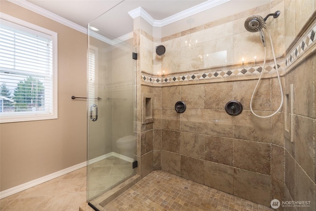 full bath featuring ornamental molding, tile patterned flooring, a tile shower, and baseboards