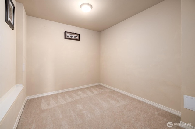 spare room with carpet flooring and baseboards