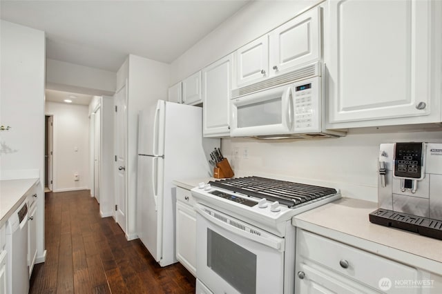 kitchen with light countertops, white appliances, dark wood-style flooring, and white cabinetry