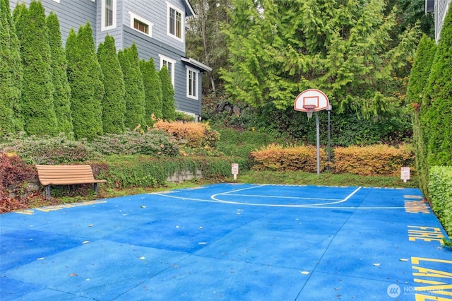 view of sport court featuring basketball hoop