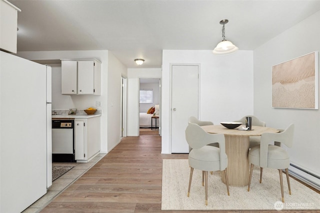 dining room featuring light wood-style flooring