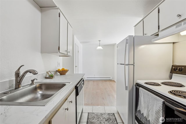kitchen with white electric range, stainless steel dishwasher, a sink, and white cabinets
