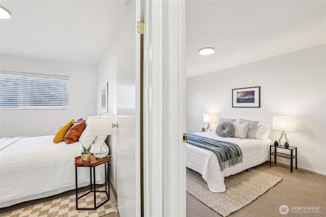 carpeted bedroom with baseboards