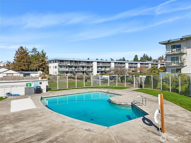 pool featuring a patio and fence