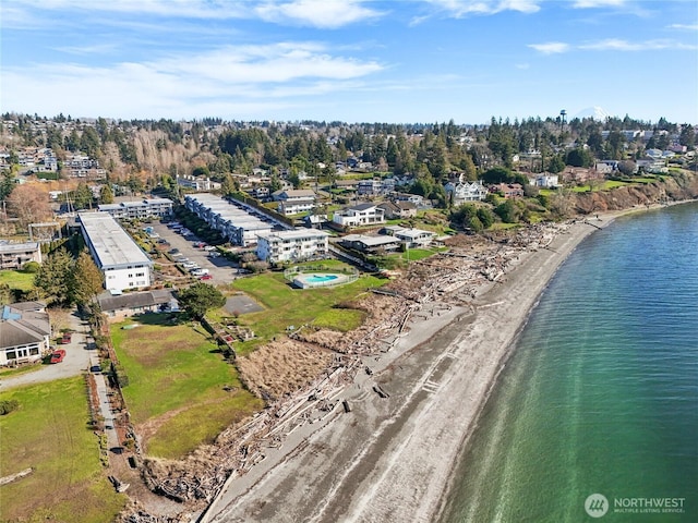 drone / aerial view with a water view and a view of the beach