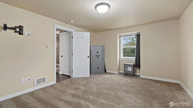 unfurnished bedroom with carpet, visible vents, and baseboards