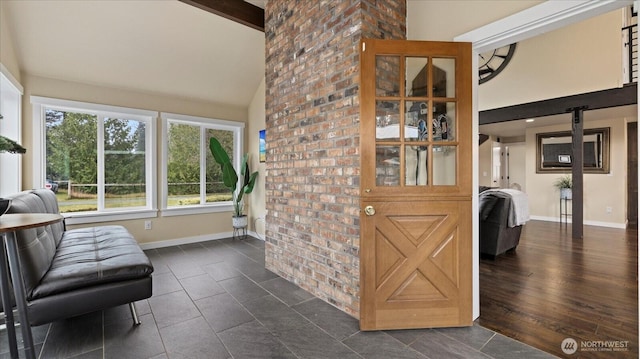 interior space with baseboards, high vaulted ceiling, and beamed ceiling