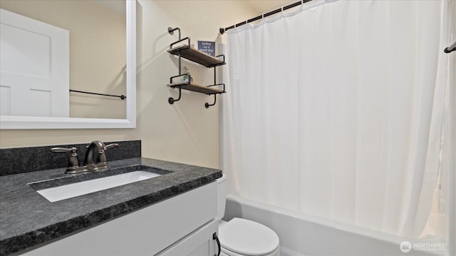 bathroom with toilet, vanity, and shower / bathtub combination with curtain