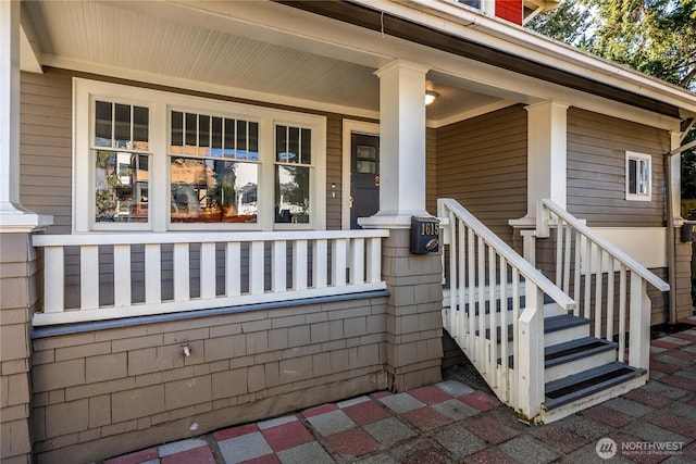 doorway to property featuring covered porch