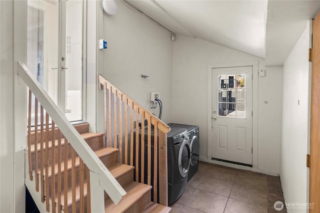 washroom featuring laundry area, tile patterned flooring, and washer and clothes dryer