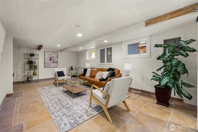 tiled living room featuring recessed lighting and baseboards