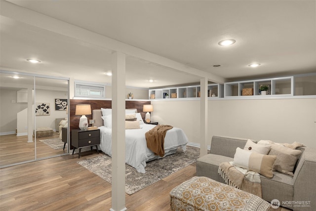 bedroom featuring wood finished floors and recessed lighting