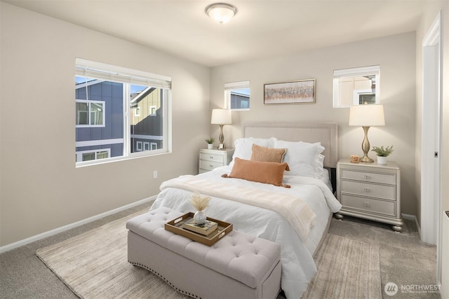 bedroom featuring carpet floors and baseboards