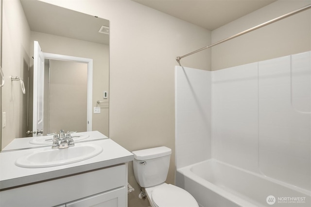 bathroom featuring toilet, shower / bath combination, visible vents, and vanity