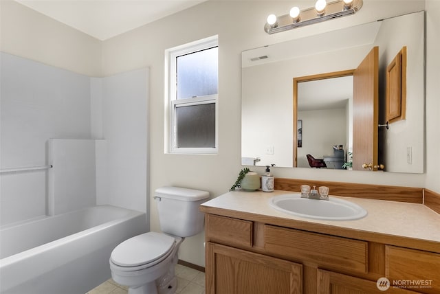 bathroom with toilet, vanity, visible vents, and tile patterned floors