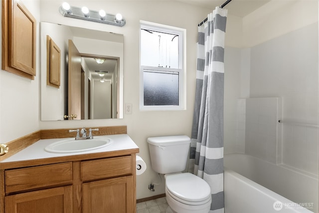 bathroom featuring vanity, toilet, and shower / bathtub combination with curtain