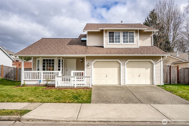 view of front of home featuring covered porch, concrete driveway, a front lawn, and fence