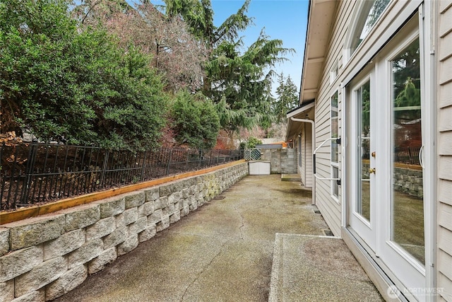 view of patio / terrace featuring a fenced backyard and a baseboard heating unit