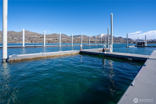 dock area featuring a water and mountain view