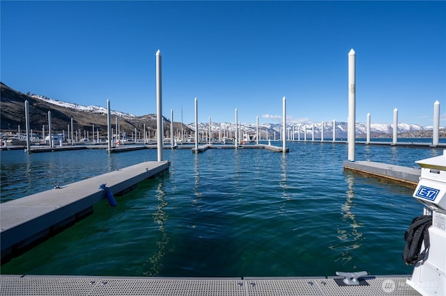 dock area featuring a water and mountain view