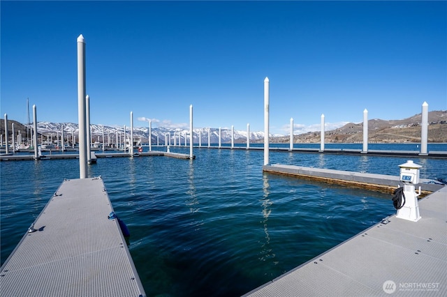 dock area featuring a water and mountain view