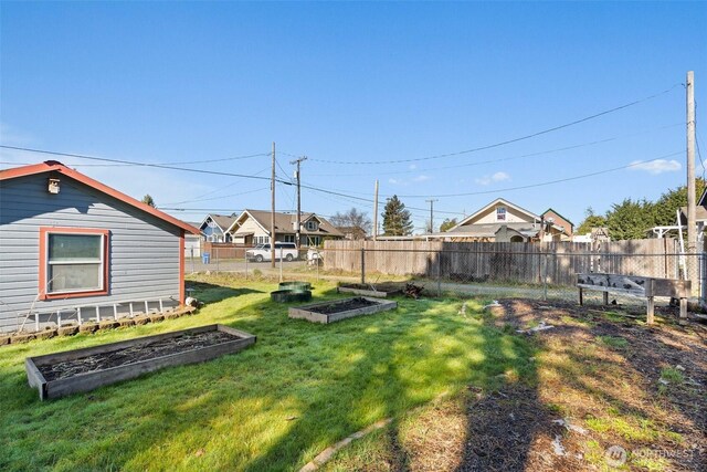 view of yard with a garden and fence