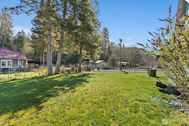 view of yard featuring fence