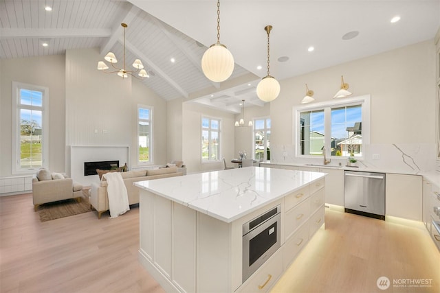 kitchen featuring a chandelier, appliances with stainless steel finishes, and light wood-style floors