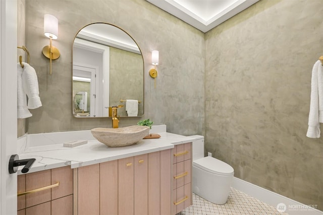 bathroom featuring toilet and vanity