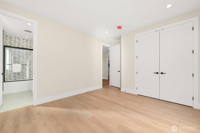 unfurnished bedroom featuring light wood-style flooring, recessed lighting, visible vents, and baseboards