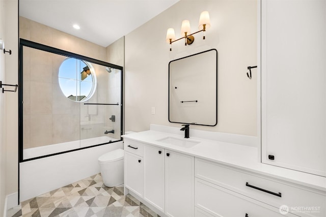 bathroom featuring vanity, toilet, recessed lighting, and shower / bath combination with glass door