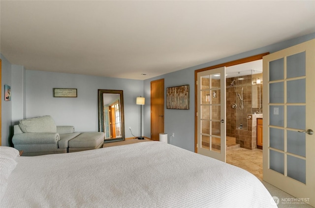 bedroom featuring ensuite bathroom and french doors