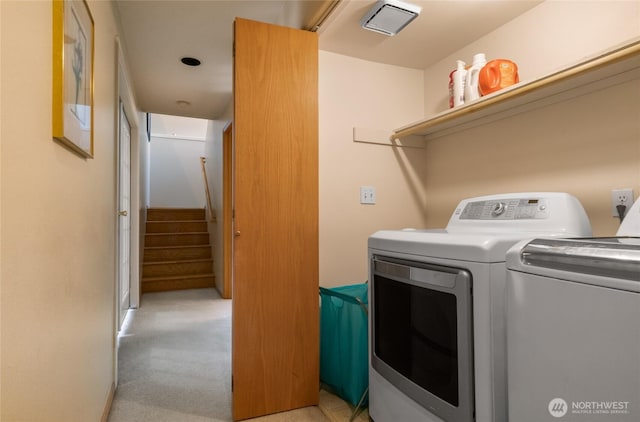 washroom with light colored carpet and independent washer and dryer