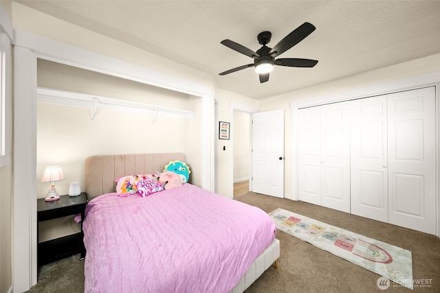 carpeted bedroom with a textured ceiling, a closet, and a ceiling fan