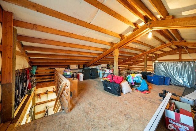 attic featuring an upstairs landing