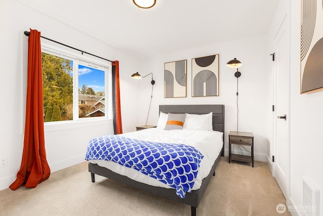 bedroom featuring carpet, visible vents, and baseboards