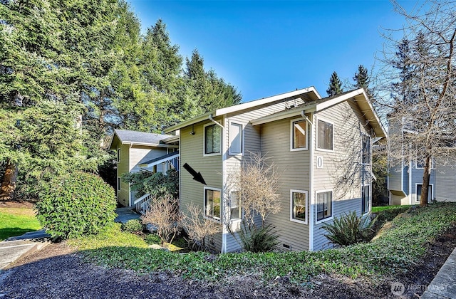 view of property exterior featuring crawl space