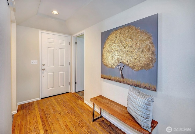 foyer featuring recessed lighting, visible vents, baseboards, and wood finished floors