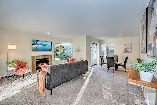 living room featuring carpet floors, recessed lighting, and a fireplace