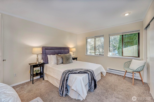 bedroom featuring baseboards, carpet floors, a baseboard radiator, and crown molding