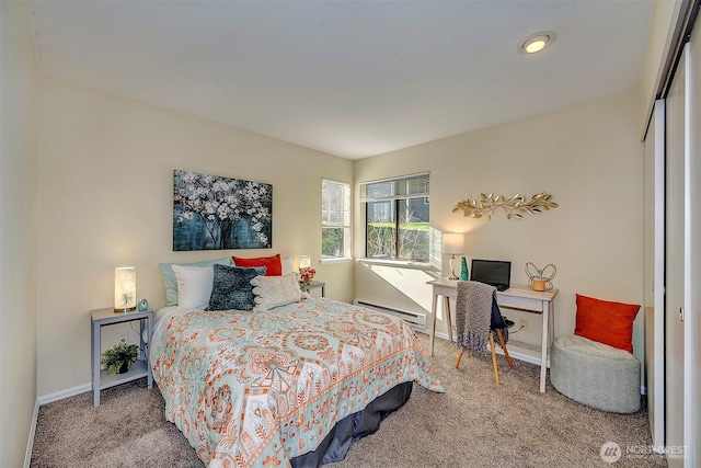 bedroom featuring a baseboard radiator, carpet flooring, and baseboards