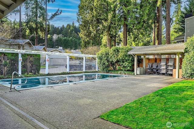 view of pool with a fenced in pool, a patio area, and fence