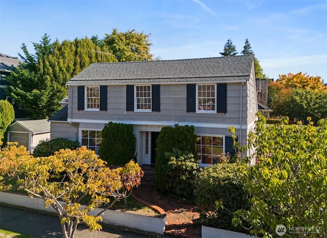 view of front of property with roof with shingles