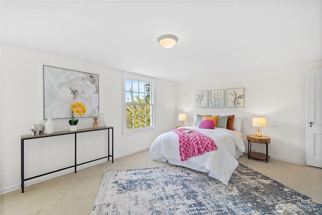 bedroom featuring carpet floors and baseboards