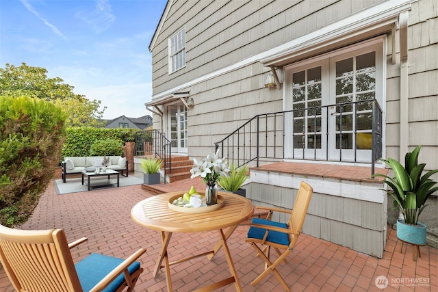 view of patio / terrace featuring french doors and an outdoor living space